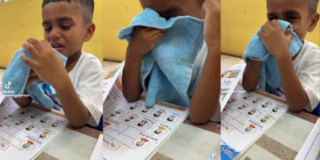 Emotional Moment, Child Seen Crying Reading About Family Topic in Class