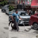 Man Casually Picks Up a Large Snake in the Middle of a Busy KL Road