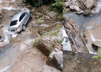 Car Slides Off Wet Road Into Rocky Streambed; Driver Fortunately Survives