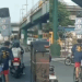 Delivery Rider in Manila Seen Balancing Boxes and a Speaker on His Head While Cycling Through Traffic