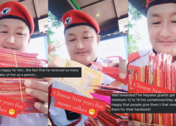 “Well rewarded!” — Security Guard Shows Stack of Angpaus Received During Chinese New Year Celebrations