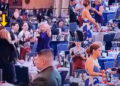 Viral Video Shows Woman Taking Wine During White House Correspondents’ Dinner Evacuation Chaos