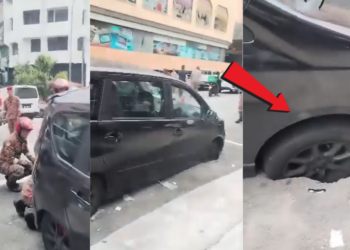 Firefighters Rescue Car Trapped in Large Sinkhole After Sudden Road Collapse in Malaysia