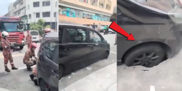 Firefighters Rescue Car Trapped in Large Sinkhole After Sudden Road Collapse in Malaysia