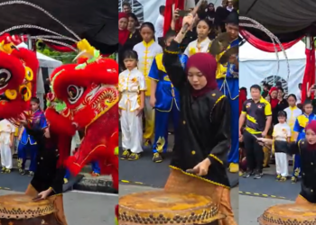 Young Female Drummer Leads Lion Dance Performance During Pesta Kaul Mukah Cultural Parade