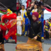 Young Female Drummer Leads Lion Dance Performance During Pesta Kaul Mukah Cultural Parade