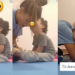 Heartfelt Moment Captured: Child with Down Syndrome Kisses Therapist while She Helps Him Put Socks on