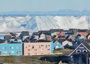 Stunning footage shows HUGE iceberg capsizing off Greenland coast