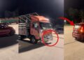 Tiny Myvi Pulls A Heavy Lorry Along The Road In Pahang