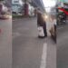 Woman Risks Busy Traffic To Fix Road Pothole Herself After Waiting For Authorities