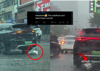 EV SUV Driving While Dragging Detached Motor Through Flooded Street