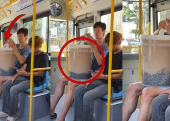 Chinese High Jumper Zhang Guowei Carries Giant Bubble Tea On Bus