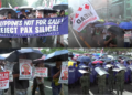 Manila protesters brave heavy rain to rally against US-backed global tech initiative