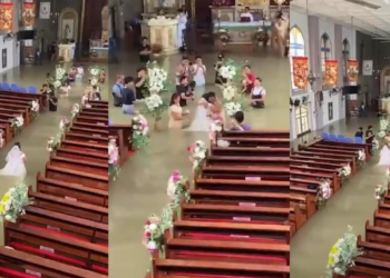 For WETTER or worse! – Philippines bride wades down flooded church aisle on wedding day