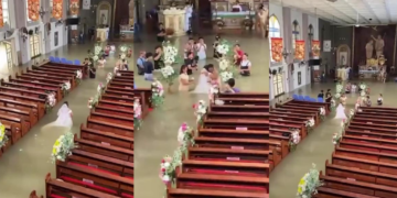 For WETTER or worse! – Philippines bride wades down flooded church aisle on wedding day