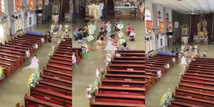 For WETTER or worse! – Philippines bride wades down flooded church aisle on wedding day
